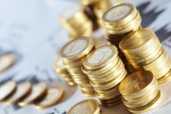 Business diagram on financial report with coins