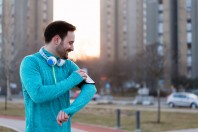 Young fitness man running in urban area