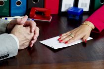 Woman offering a bribe in the envelope