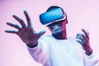 African american man in vr glasses, playing video games with virtual reality headset, trying to touch something with hand