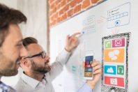 Designers drawing website ux app development.