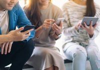 Group of people using and looking at mobile phone and tablet pc
