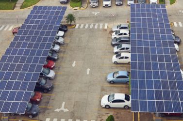 Parking lot with solar panel on roof aerial above view
