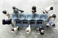 Business people playing musical chairs