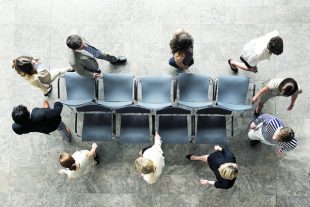 Business people playing musical chairs