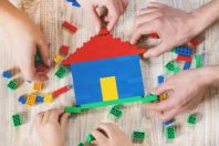 Build a designer Lego house. Selective background. play