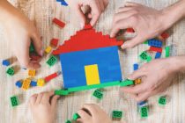 Build a designer Lego house. Selective background. play