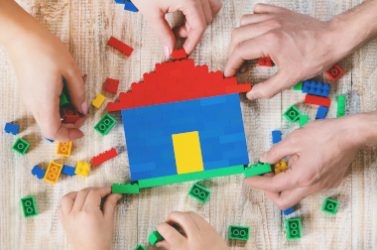 Build a designer Lego house. Selective background. play