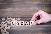 Local. Wooden letters on the office desk