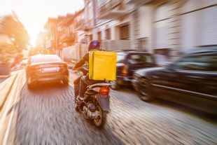 Fast and free delivery food by scooter in the afternoon in the c