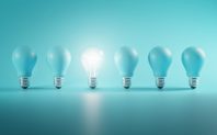Outstanding Idea Concept. Glowing Bulb Between Unlit Blue Bulbs Minimal.