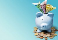 Blue Piggybank Full Of Euro Notes And Euro Coins