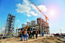 Construction Site with Cranes and construction worker