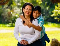 Mother,And,Son,Outdoor,Lifestyle,Portrait,In,A,Park,Setting.