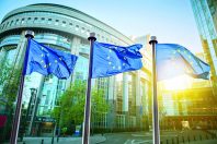 European union flag against parliament in Brussels