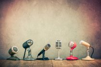 Retro old microphones for press conference or interview on woode