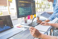 Programmer working in a software development and coding technolo