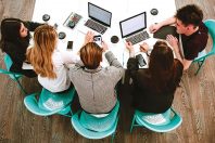 Startup business ideas sitting at a Desk creative group of businessmen spend brainstorming. The concept of entrepreneurship and enterprise.