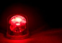 Emergency rotating alarm red light at night.