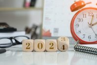2024 new year idea concept. 2024 text on wooden blocks with data analysis and office concept background. Budgeting concept.