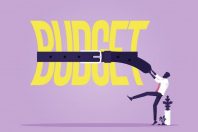 Tight budget and recession shrinking economy concept, Saving money, Businessman use belts tighten budget word, economy concept