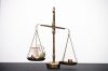 Money weighing on justice scale. Payment balance and tax