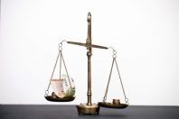 Money weighing on justice scale. Payment balance and tax