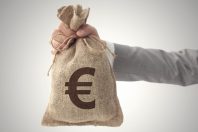 Money bag with Euro sign European Union currency business man holding up