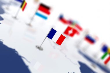 France flag in the focus. Europe map with countries flags