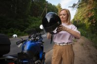 front-view-cool-old-woman-with-motorbike-min