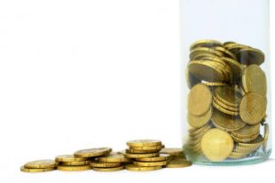 coins piled up on table saving money no people on white background stock images stock photo