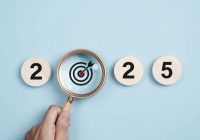 Happy new year 2025 with business concept. 2025 year number with Target icon inside the golden magnifying glass on light blue background. Planning for goal and success concepts. New Year resolution