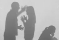 Silhouettes of quarreling parents and little child on white back