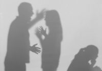 Silhouettes of quarreling parents and little child on white back