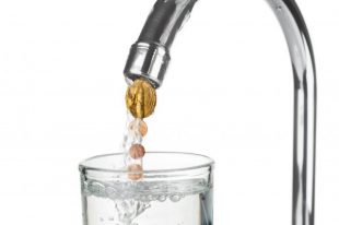 Euro coins flowing with water from a tap on white background