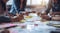 Business people brainstorming. People use stickers to save their ideas. Business project planning. The concept of brainstorming in a startup in a team.