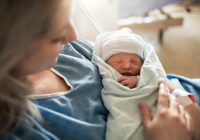 Mother with her newborn baby at the hospital a day after a natural birth labor
