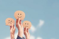 Customer showing rating with happy icon on sky background, Custo