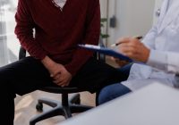 Professional doctor working with patient in hospital, space for text