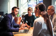 Business people talking about project in a cafe